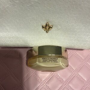 Guerlain Abeille Royale Day Cream and cream colored pouch